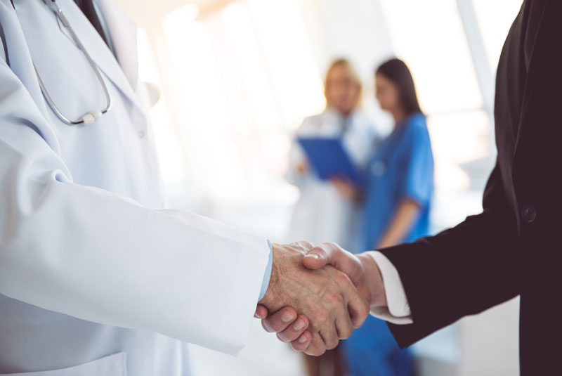 doctor shaking hand of patient