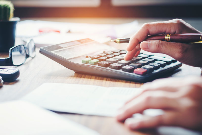 person doing finances contemplating dental procedure